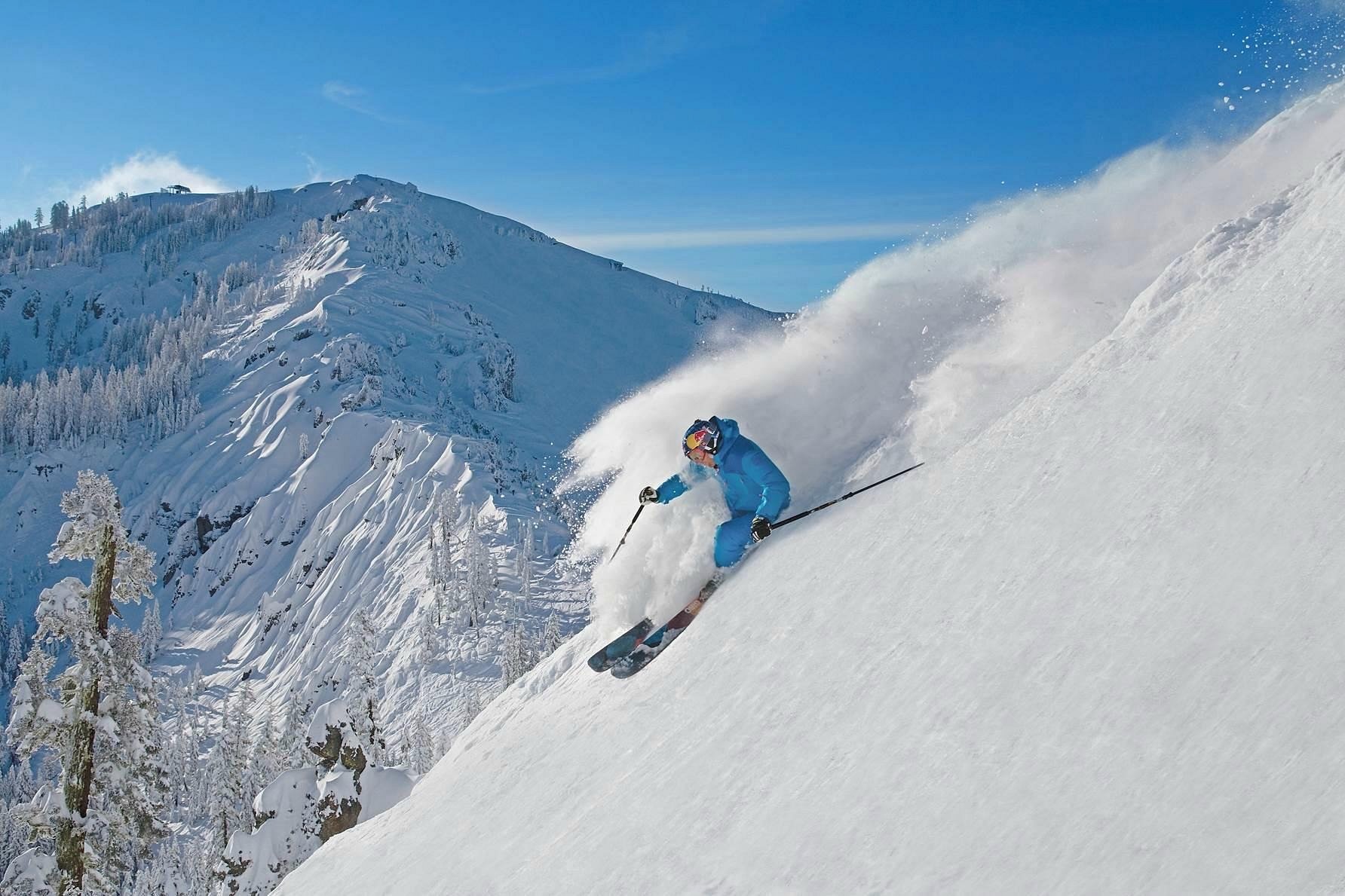 Skiers on a snow-covered run at a Donner Summit resort near Lake Tahoe